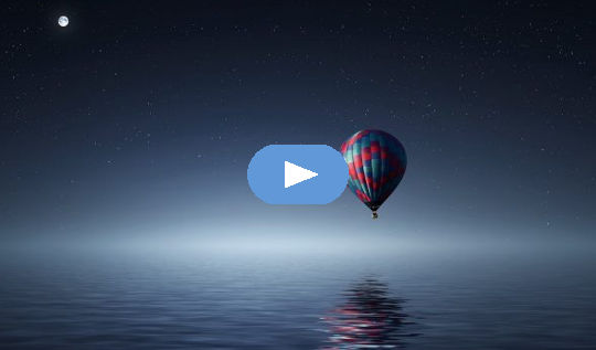 full moon over a hot air balloon