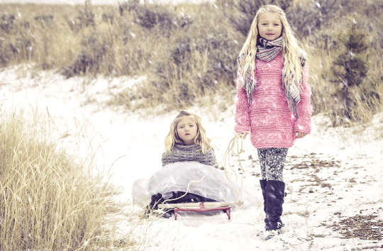 two siblings in the snow