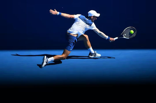 ahtlete hitting a ball with a racket at the Australian Open