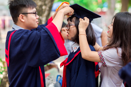 graduate with friends