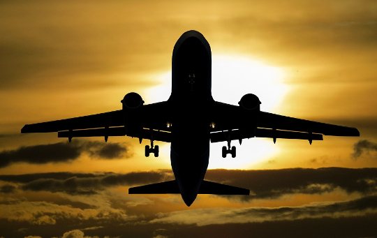 an airplane gaining altitude in the sky