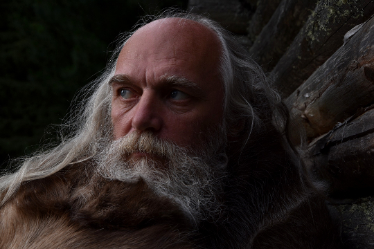 photo of older white man with beard and flowing long hair