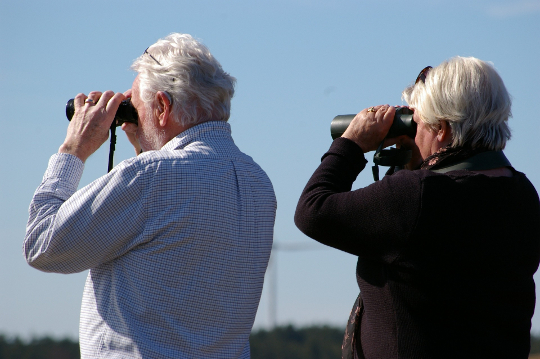 an older couple with binoculars