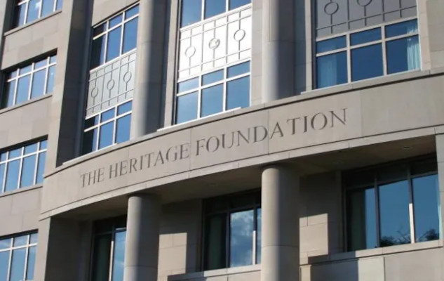 A depiction of the Heritage Foundation’s influence on U.S. governance showing how its policy blueprints have eroded democracy and concentrated power among elites.