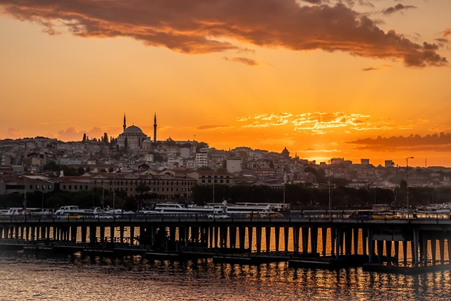 the city of Istanbul and dock stretching out into the sea