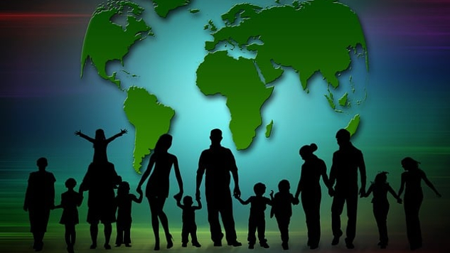 families holding hands with the map of the world in the background