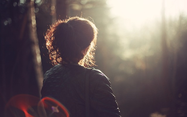 woman staring out into the light