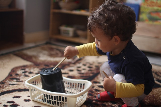 child playing with educational tool