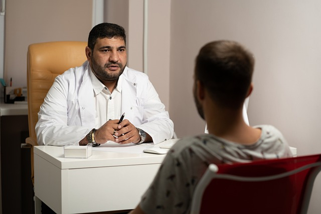 overweight doctor speaking with his patient