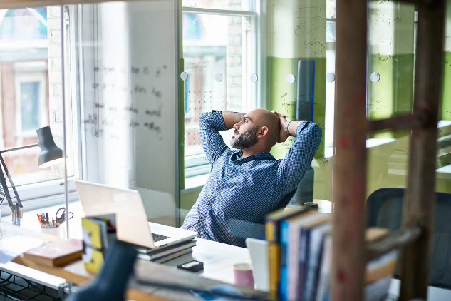 A person pausing before sharing something online, symbolizing the importance of thinking before spreading information.