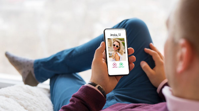 Person swiping on a dating app, representing the pursuit of successful online dating.