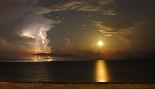 Lightning and the Moon. Photo by Marc-André Besel. 