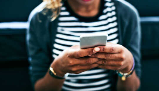 woman holding smartphone