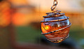 a glowing orb in a pendant with a copper wire wrap