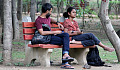 a couple sitting on a bench